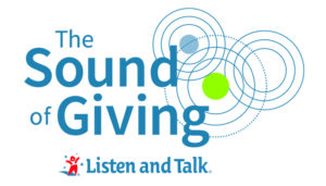 The words The Sound of Giving in blue font with three blue lines in circle shapes overlapping. One larger circle has a green filled in circle in the middle. The one circle above and to the left has a blue filled in circle in the middle. Under the text is a Listen in Talk logo with a red figure of a child with hands up to the left.